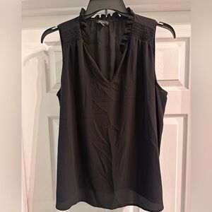 Sleeveless ruffle neck blouse